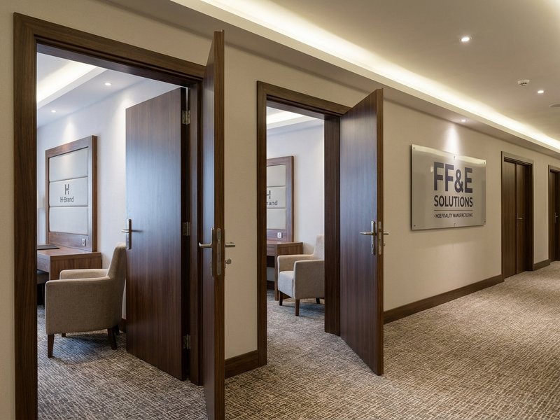 Hotel FF&E segment showing branded guestroom furniture at scale